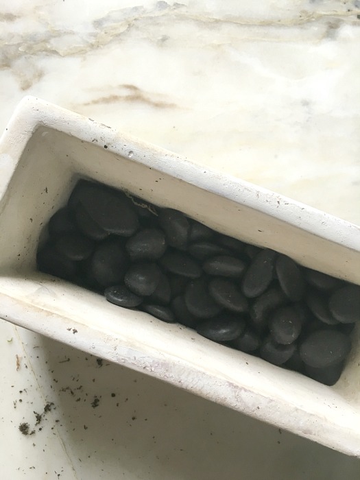 stones in a white rectangular pot stones in a white rectangular pot