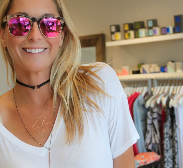 woman wearing Rose gold sunglasses and trendy summer accessories woman wearing Rose gold sunglasses and trendy summer accessories