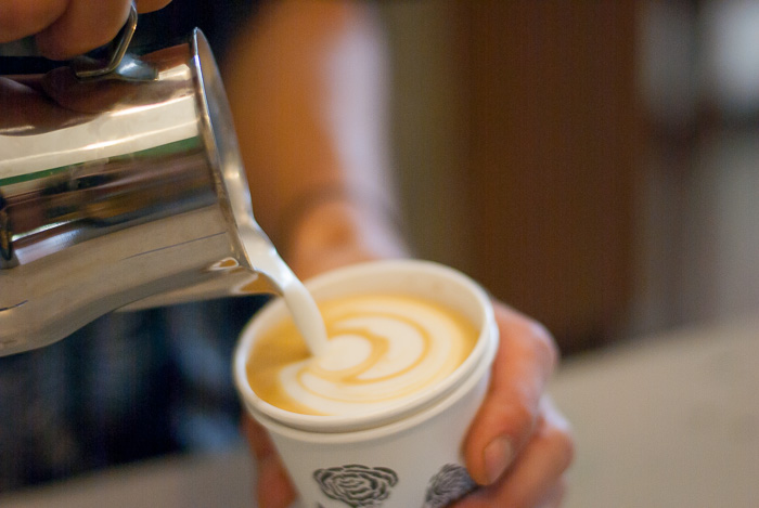 barista making coffee from one of the best Chicago area coffee shops barista making coffee from one of the best Chicago area coffee shops