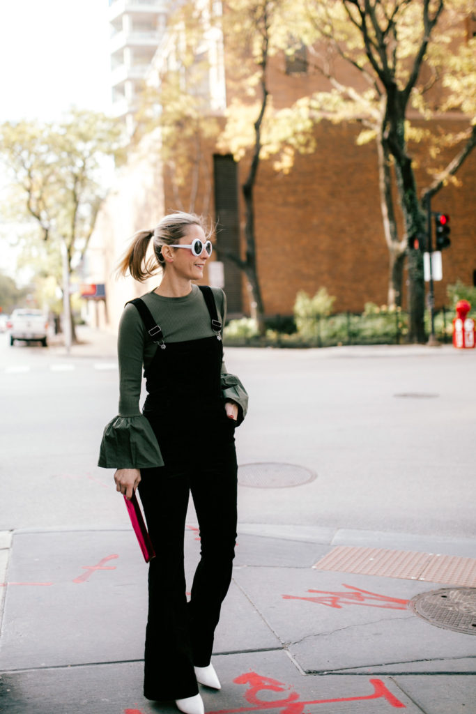 woman Wearing Velvet Overalls for the Holidays woman Wearing Velvet Overalls for the Holidays