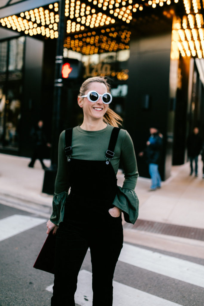 woman wearing green long sleeves and black jumper woman wearing green long sleeves and black jumper