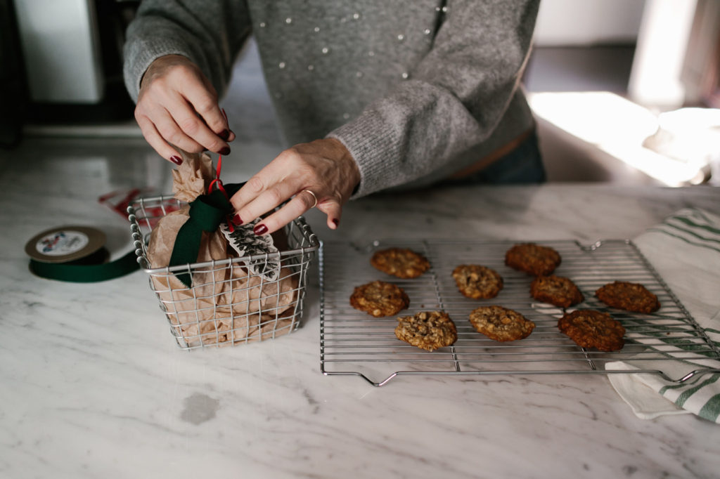 Presentation of a simple holiday cookie with wire basket, wax paper, gift tag and ribbonPresentation of a simple holiday cookie with wire basket, wax paper, gift tag and ribbon Presentation of a simple holiday cookie with wire basket, wax paper, gift tag and ribbon