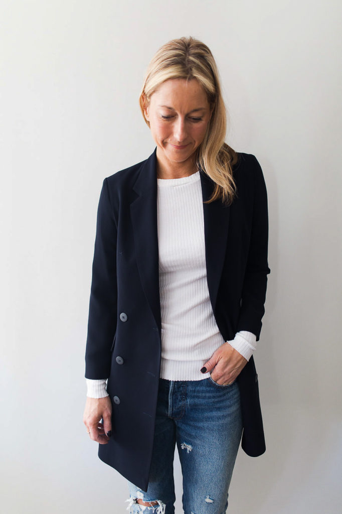 woman wearing blue blazer woman wearing a A longer styled navy blazer also serves nicely as a lightweight coat