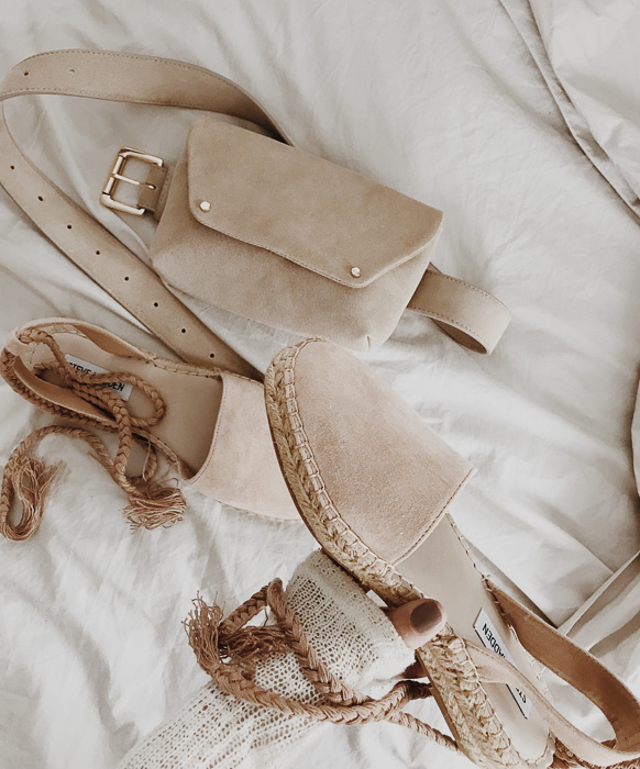 Detailed shot of neutral blush belt bag and espadrilles Detailed shot of neutral blush belt bag and espadrilles
