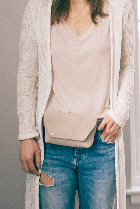 woman wearing blush shirt and cardigan woman wearing blush shirt and cardigan