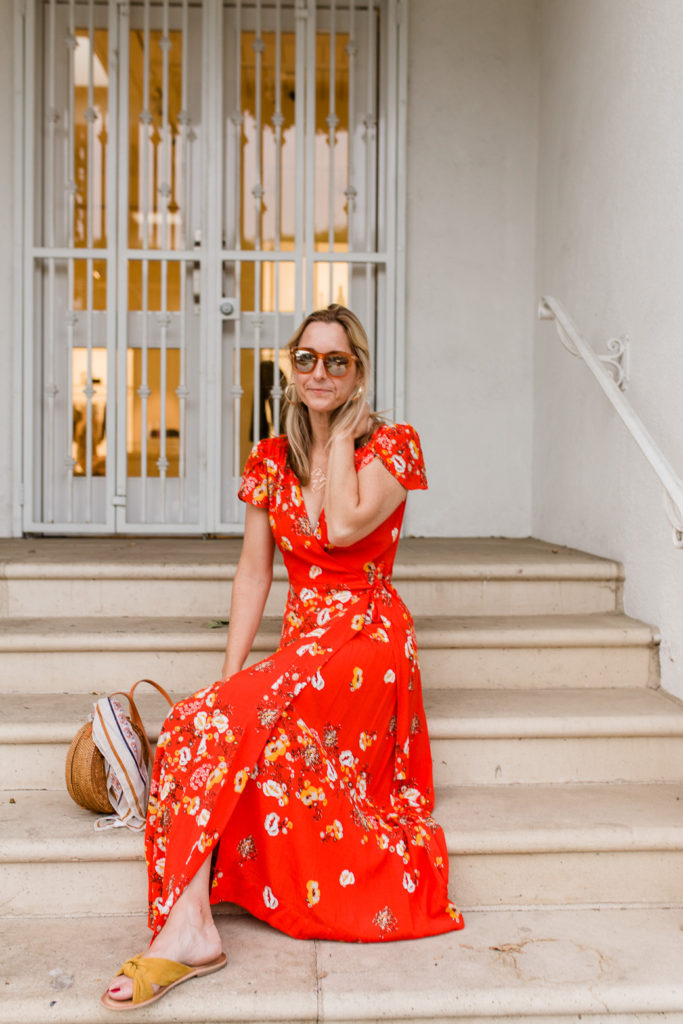 A floral dress with a woven back and gold statement earrings for spring