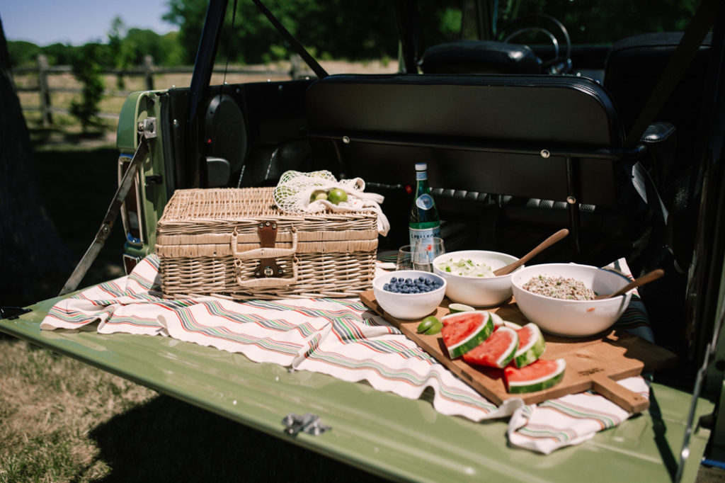 Picnic essentials including picnic basket, chilled serving bowls, Govino glasses and Turkish towels